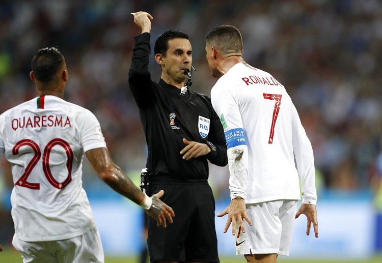 Cristiano Ronaldo reacts at referee Cesar Arturo Ramos after yellow card in World Cup 2018