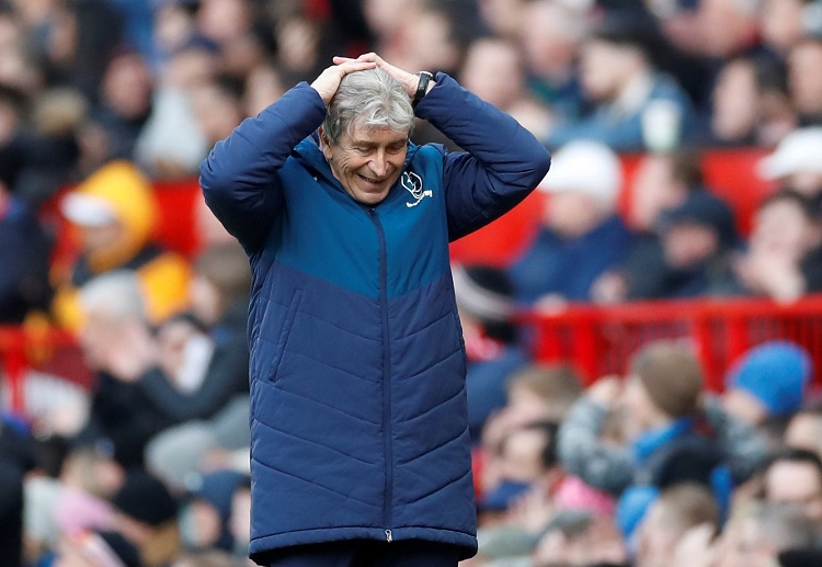 West Ham boss Manuel Pellegrini looks defeated during their Premier League battle against Manchester United