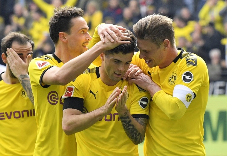 Borussia Dortmund players are delighted as they keep their Bundesliga hopes alive with a win over Fortuna