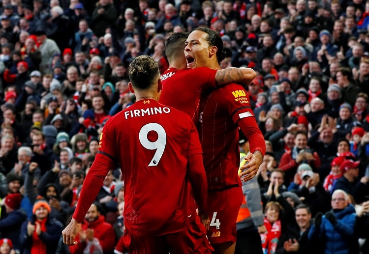 Virgil van Dijk celebrates with teammates after scoring for Liverpool in their Premier League clash with Brighton