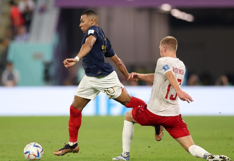 Kylian Mbappe celebrates after scoring a goal against Denmark in their World Cup 2022 match.